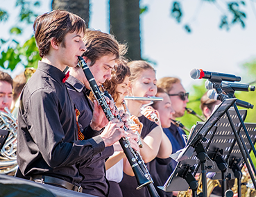 musicians playing outdoors at a concert
